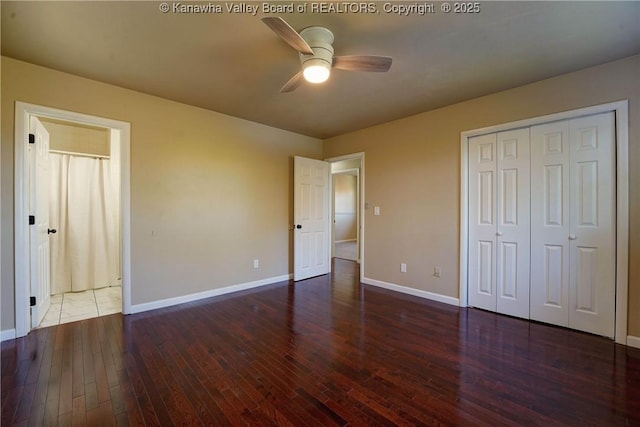 unfurnished bedroom featuring ceiling fan, dark hardwood / wood-style flooring, and a closet