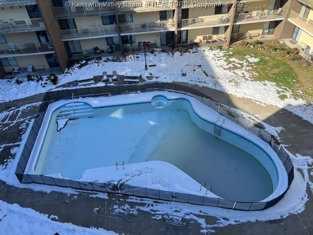 view of snow covered pool