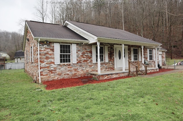 ranch-style house with a porch and a front lawn