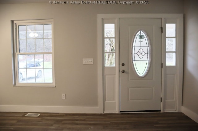 entrance foyer featuring dark hardwood / wood-style floors