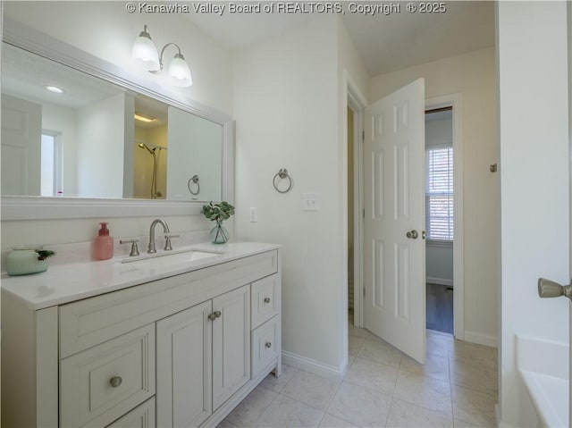 bathroom with vanity and tile patterned flooring