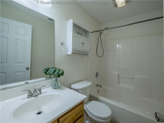 full bathroom with toilet, vanity, and bathtub / shower combination