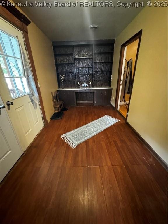 bar featuring dark hardwood / wood-style flooring