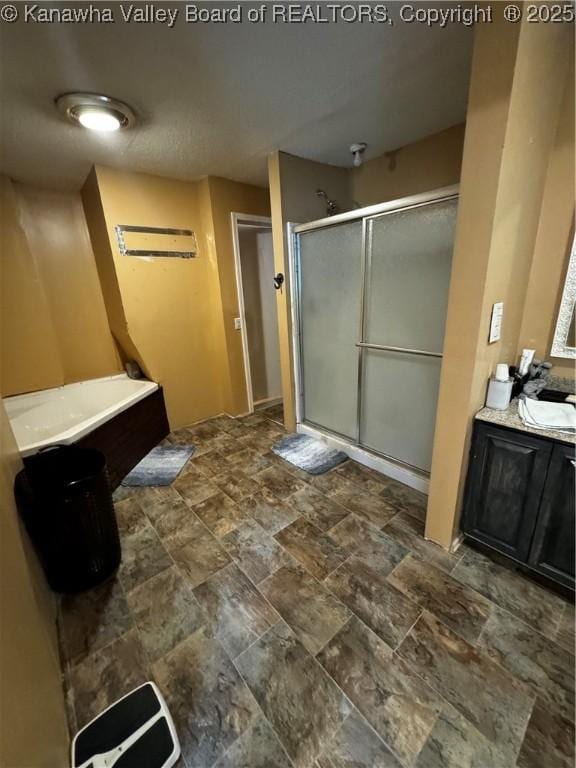 bathroom with plus walk in shower and vanity