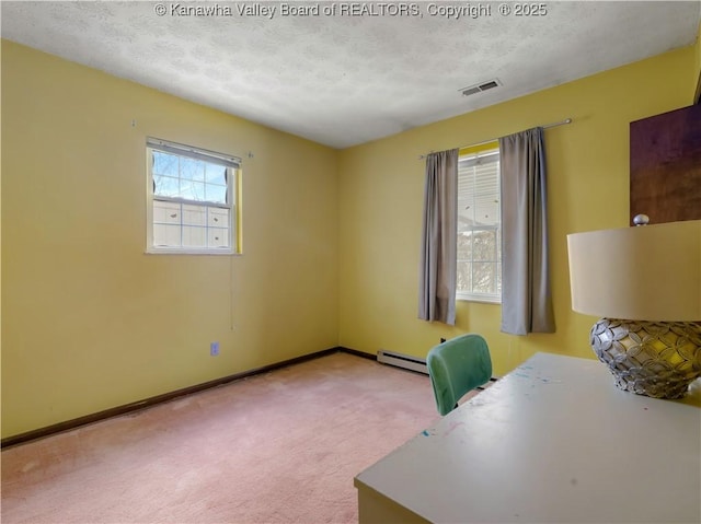 carpeted home office featuring a baseboard radiator and a textured ceiling