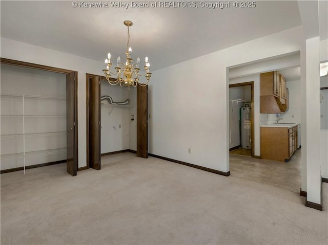 unfurnished dining area with water heater, sink, light colored carpet, and a notable chandelier