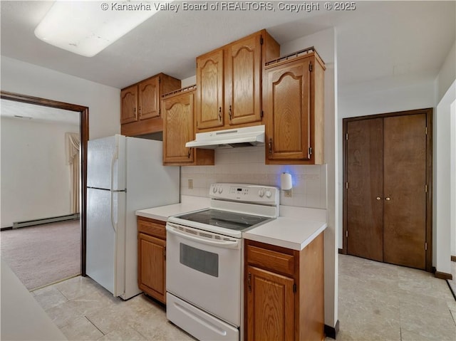 kitchen featuring tasteful backsplash, a baseboard heating unit, light carpet, and white appliances