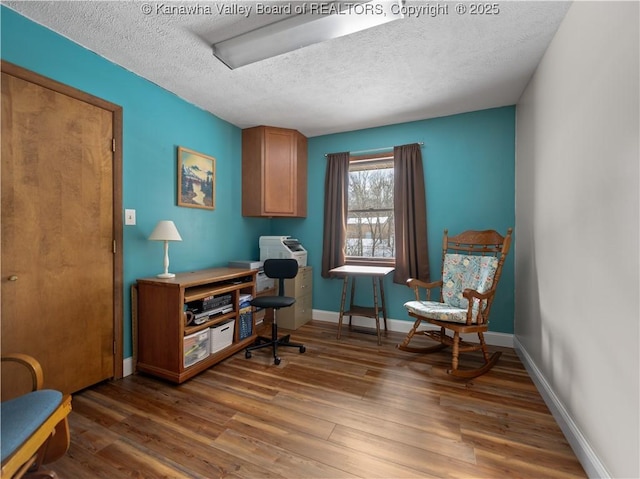 office space with dark wood-type flooring and a textured ceiling