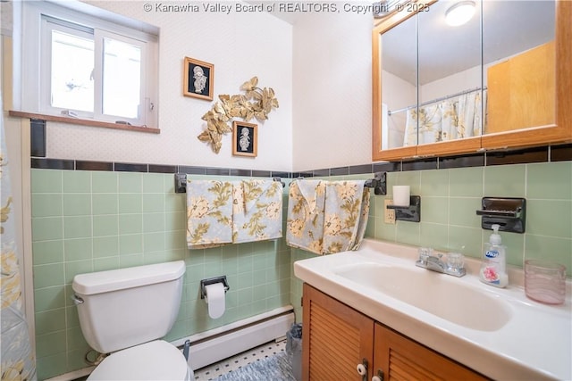 bathroom featuring baseboard heating, tile walls, toilet, and vanity