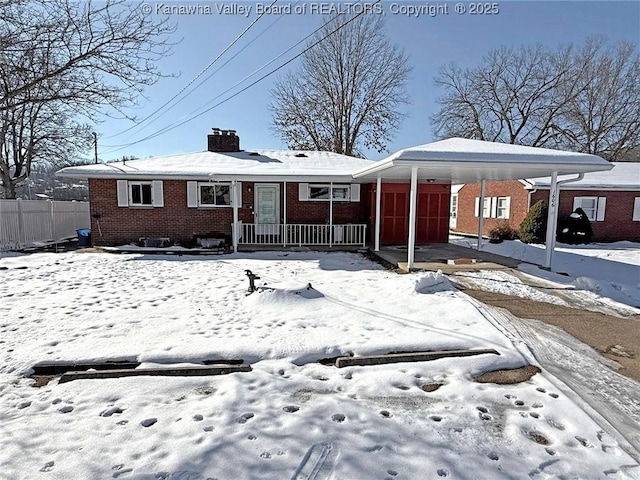 view of front of home featuring a carport