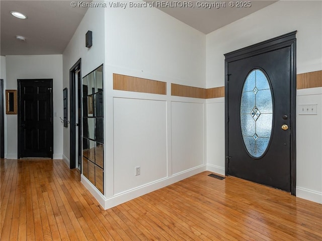 foyer entrance featuring wood-type flooring