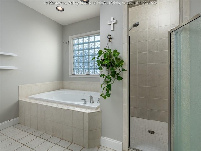 bathroom featuring tile patterned flooring and plus walk in shower