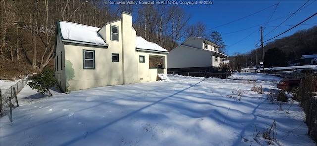 view of snow covered property