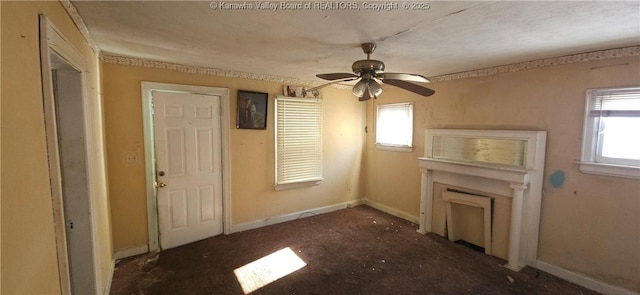 unfurnished living room featuring ceiling fan