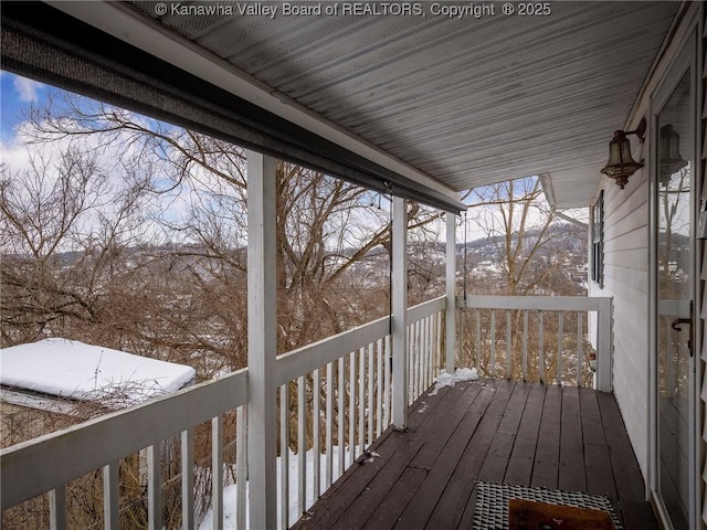 view of snow covered deck