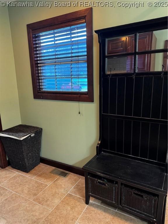 mudroom with light tile patterned flooring