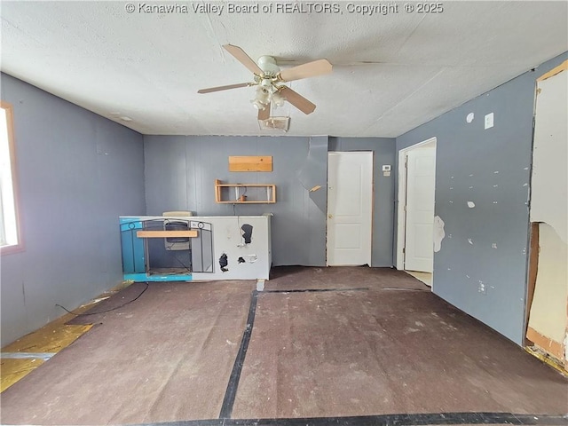 interior space featuring ceiling fan