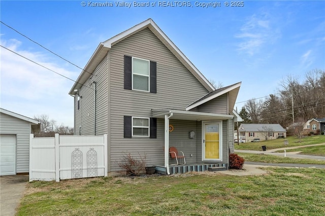 view of front of home with a garage and a front yard