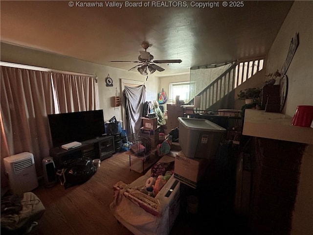 interior space featuring ceiling fan and hardwood / wood-style flooring