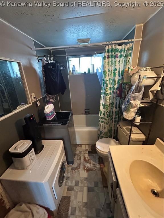 full bathroom with toilet, shower / tub combo, and vanity