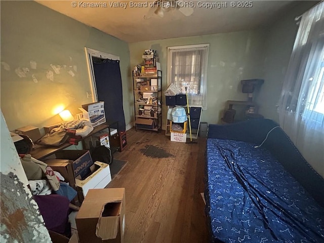 bedroom featuring wood-type flooring