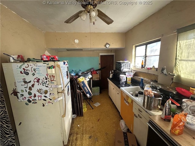 kitchen featuring ceiling fan, white cabinets, and white fridge