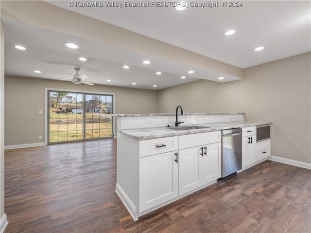 kitchen with ceiling fan, stainless steel dishwasher, sink, light stone countertops, and white cabinets