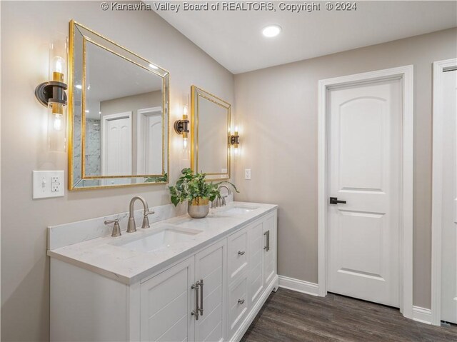 bathroom featuring wood-type flooring and vanity