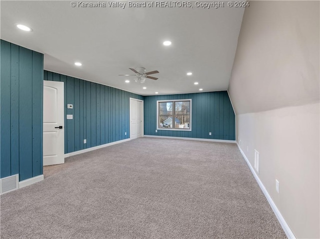 carpeted cinema featuring ceiling fan and lofted ceiling