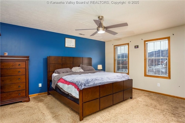 bedroom with light carpet and ceiling fan