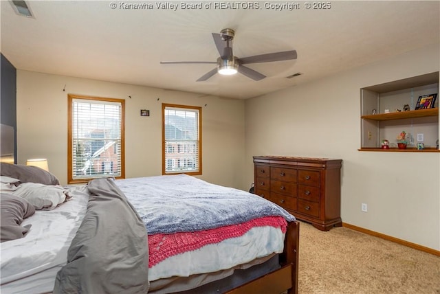 bedroom with ceiling fan and light colored carpet