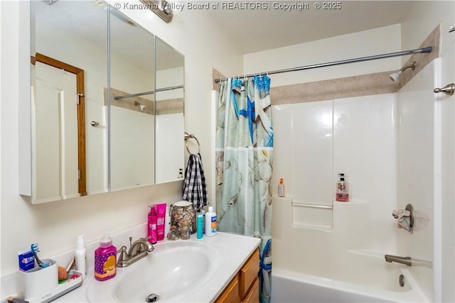 bathroom with vanity and shower / bath combo with shower curtain