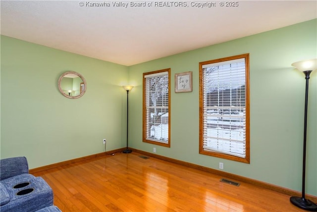 unfurnished room featuring hardwood / wood-style floors