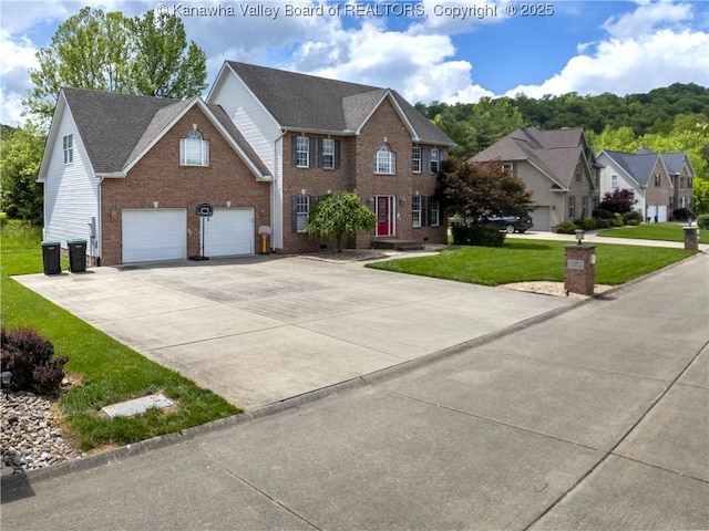 140 Waterside Cir, Winfield, WV 25213 - colonial home with brick siding, a front lawn, driveway, and an attached garage