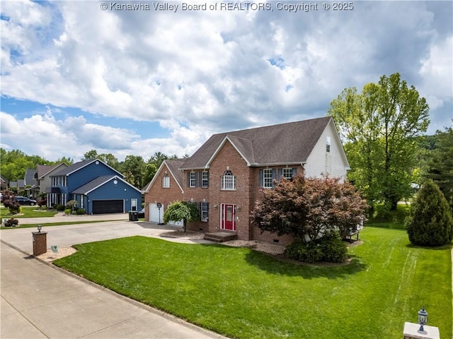 140 Waterside Cir, Winfield, WV 25213 - colonial-style house featuring driveway, brick siding, and a front lawn