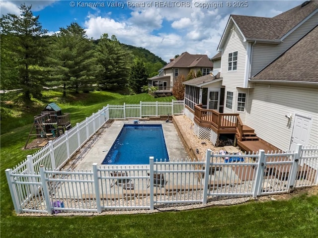 140 Waterside Cir, Winfield, WV 25213 - view of swimming pool with a fenced backyard, a wooden deck, and a playground