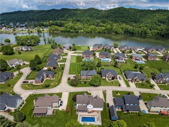 140 Waterside Cir, Winfield, WV 25213 - aerial overview of property's location with a large body of water, nearby suburban area, and a forest