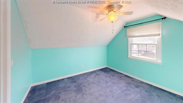 bonus room featuring carpet, ceiling fan, lofted ceiling, and baseboards