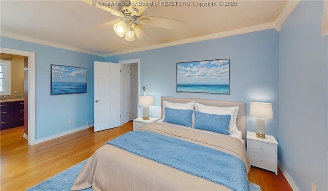 bedroom featuring crown molding, baseboards, and wood finished floors