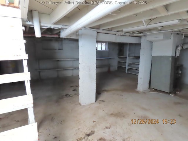 basement featuring heating unit