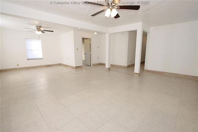 spare room with light tile patterned flooring and ceiling fan