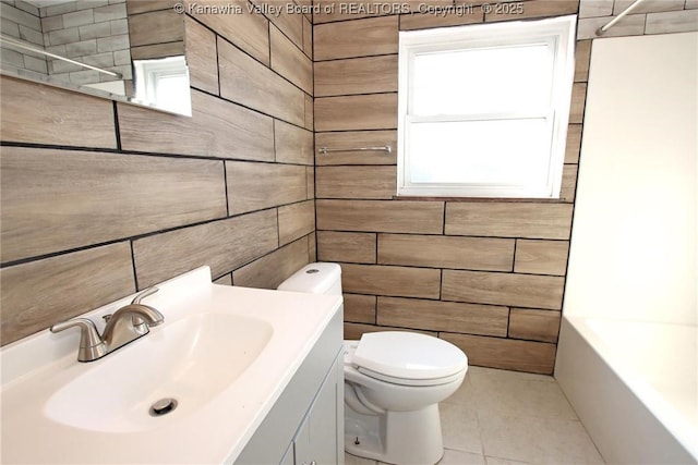 bathroom with tile patterned floors, vanity, and toilet