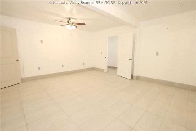 tiled spare room featuring beamed ceiling and ceiling fan