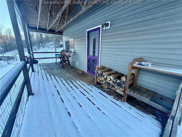 view of snow covered deck