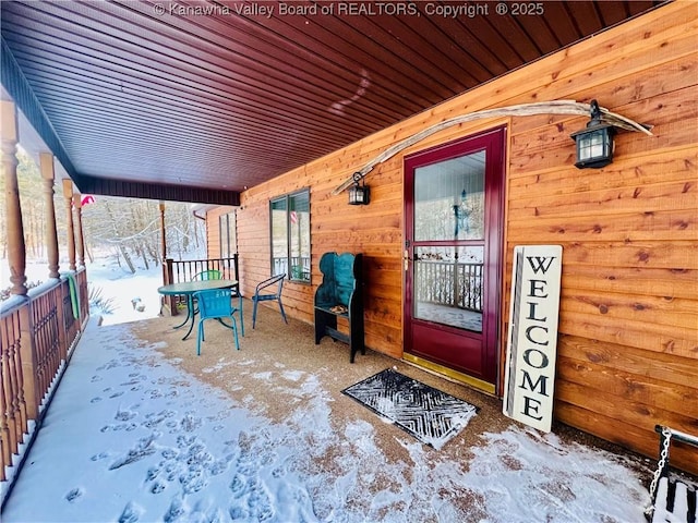 view of snow covered property entrance