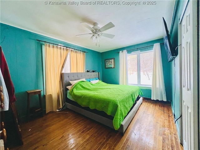 bedroom featuring ceiling fan and hardwood / wood-style floors