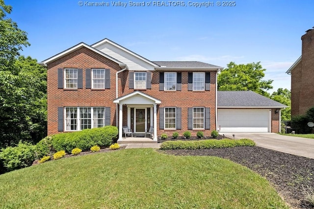 colonial-style house with a garage and a front lawn