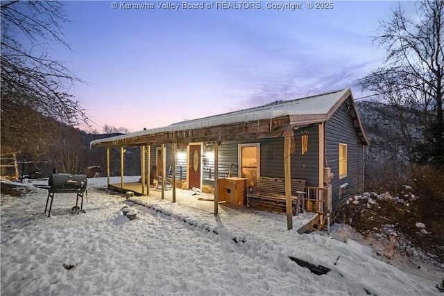 view of snow covered house