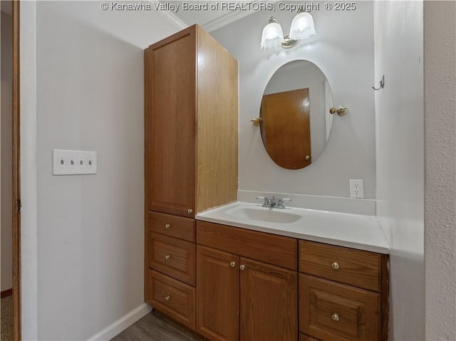 bathroom with vanity and crown molding