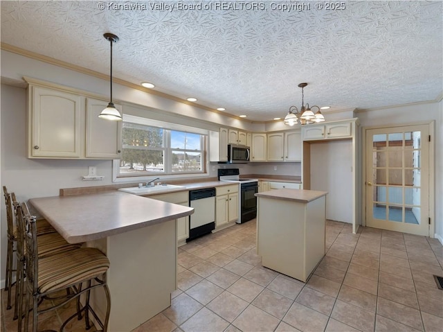 kitchen with pendant lighting, stainless steel appliances, crown molding, and a textured ceiling